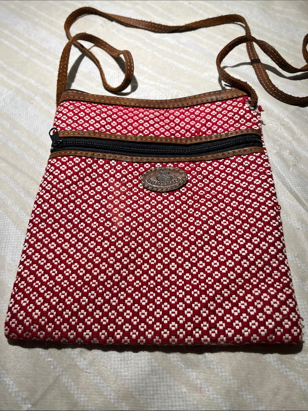 Red Woven Crossbody Bag with Brown Trim and Front Zip